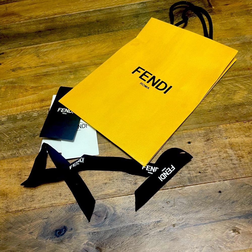 Fendi bag, tags, and bow